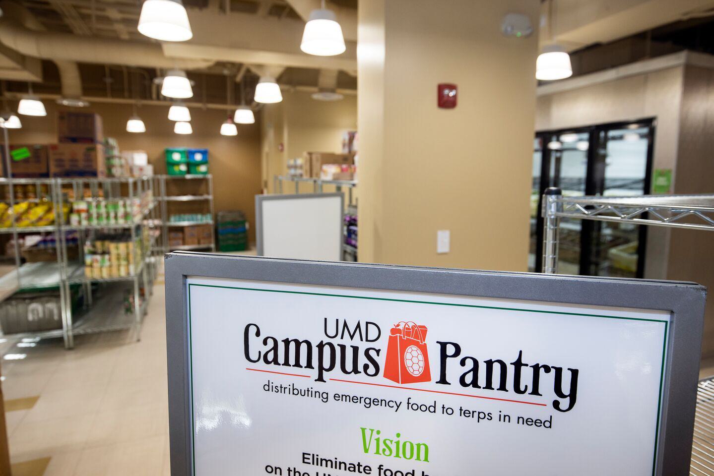 Shelves with food, sign with UMD Campus Pantry